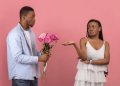 Man giving woman flower